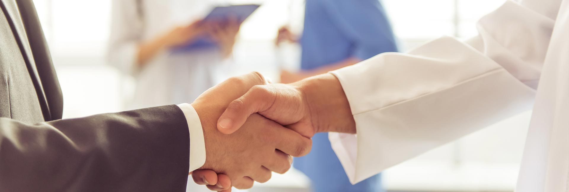 Doctor shaking hands with a client